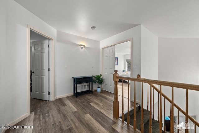 250 Botanical Cir, Anchorage, AK 99515 - corridor featuring dark wood finished floors and an upstairs landing