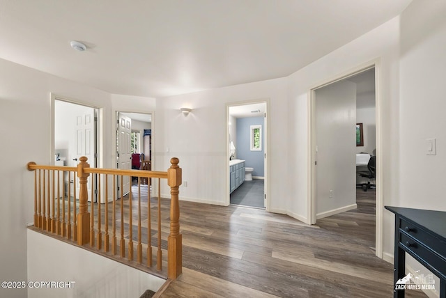 250 Botanical Cir, Anchorage, AK 99515 - hall featuring an upstairs landing, wood finished floors, and a desk