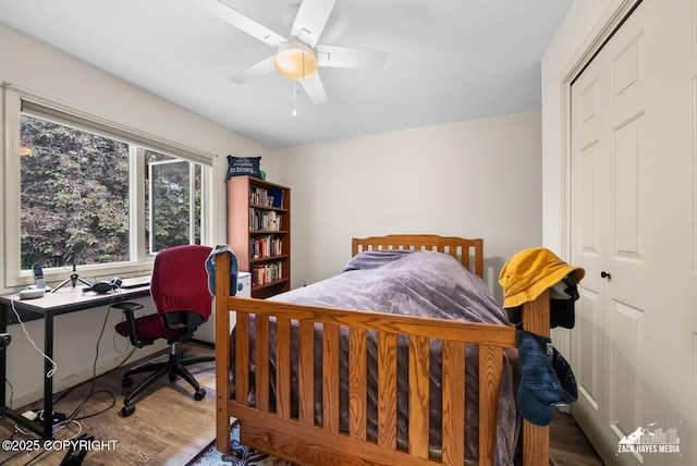 250 Botanical Cir, Anchorage, AK 99515 - bedroom with wood finished floors, a desk, and a ceiling fan