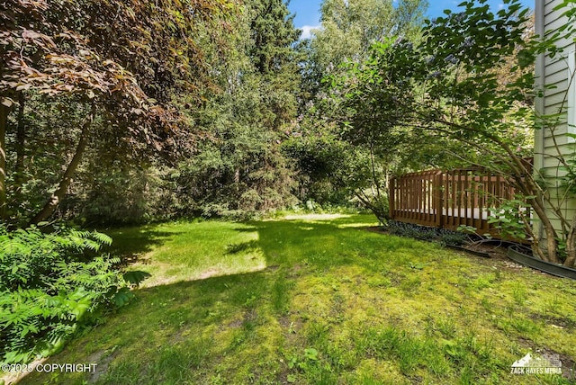 250 Botanical Cir, Anchorage, AK 99515 - view of grassy yard with a deck