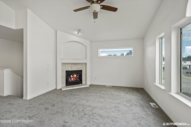 221 Whisper Ridge Cir # A, Anchorage, AK 99504 - unfurnished living room with healthy amount of natural light, carpet floors, and vaulted ceiling