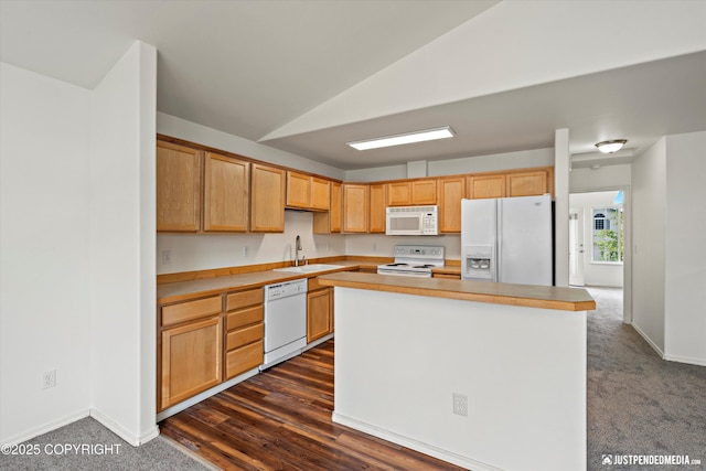 221 Whisper Ridge Cir # A, Anchorage, AK 99504 - kitchen featuring white appliances, vaulted ceiling, a center island, light countertops, and dark carpet