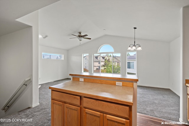 221 Whisper Ridge Cir # A, Anchorage, AK 99504 - kitchen featuring lofted ceiling, healthy amount of natural light, a ceiling fan, open floor plan, and decorative light fixtures