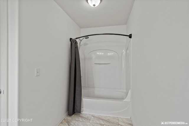 221 Whisper Ridge Cir # A, Anchorage, AK 99504 - bathroom with shower / bath combo with shower curtain and marble finish floors