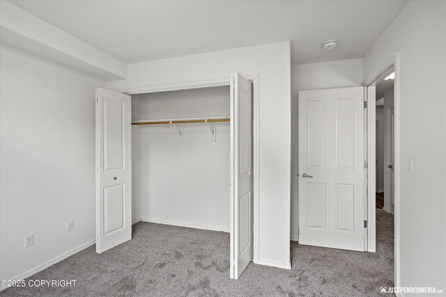 221 Whisper Ridge Cir # A, Anchorage, AK 99504 - unfurnished bedroom featuring carpet and a closet