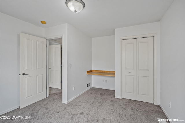 221 Whisper Ridge Cir # A, Anchorage, AK 99504 - unfurnished bedroom featuring carpet floors and a closet