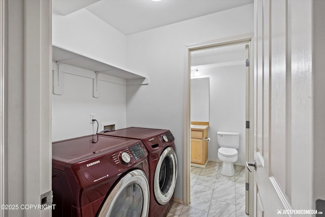 221 Whisper Ridge Cir # A, Anchorage, AK 99504 - laundry area with washer and dryer and light marble finish floors