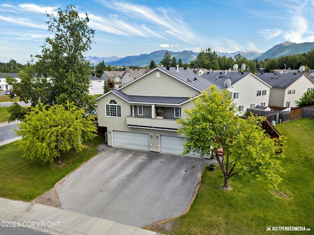 221 Whisper Ridge Cir # A, Anchorage, AK 99504 - traditional-style home featuring a garage, a residential view, a mountain view, and asphalt driveway