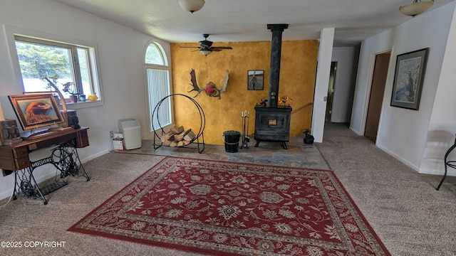 3411 Eagle Ave, Valdez, AK 99686 - carpeted living area with ceiling fan and a wood stove