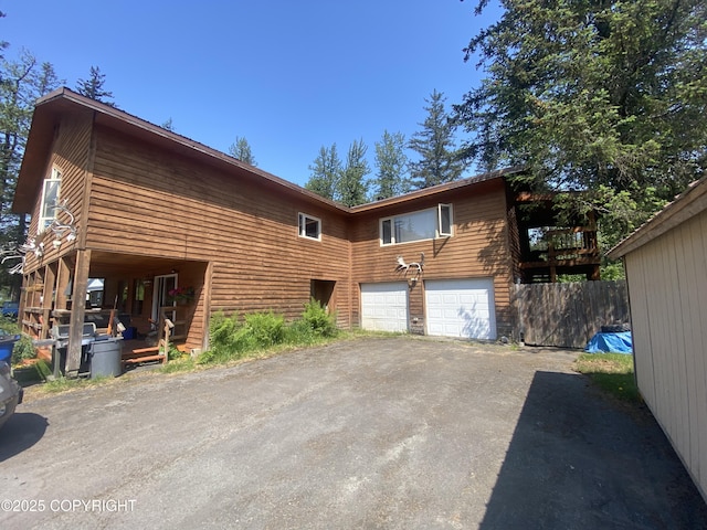 3411 Eagle Ave, Valdez, AK 99686 - view of property exterior featuring asphalt driveway and a garage