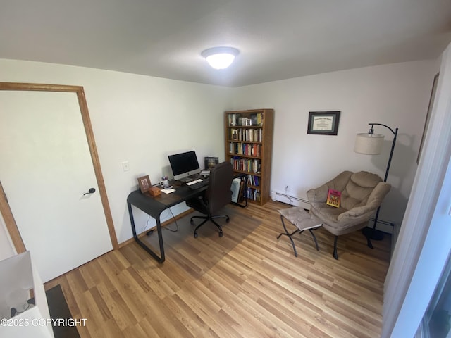 3411 Eagle Ave, Valdez, AK 99686 - office area with a baseboard heating unit and light wood-type flooring