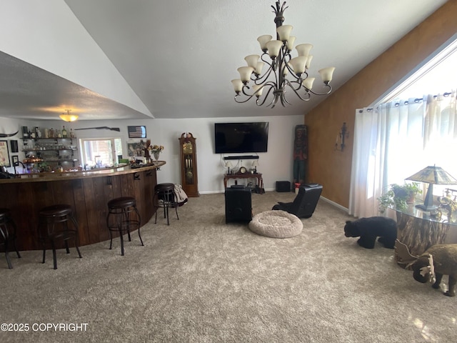 3411 Eagle Ave, Valdez, AK 99686 - living area featuring vaulted ceiling, carpet, a bar, and a chandelier