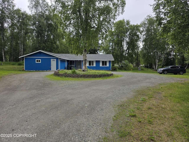4100 W Peterson Bay Ct, Wasilla, AK 99623 - ranch-style home with dirt driveway, view of scattered trees, and a front lawn