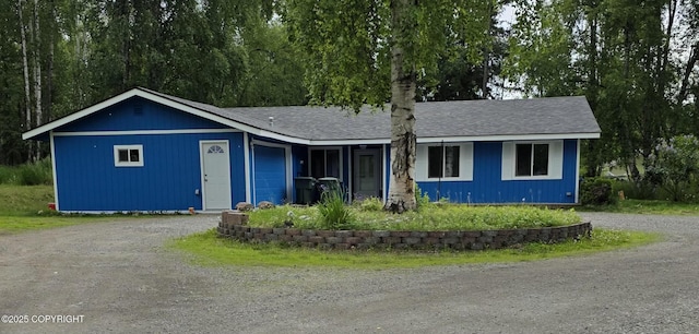 4100 W Peterson Bay Ct, Wasilla, AK 99623 - ranch-style home featuring dirt driveway and roof with shingles