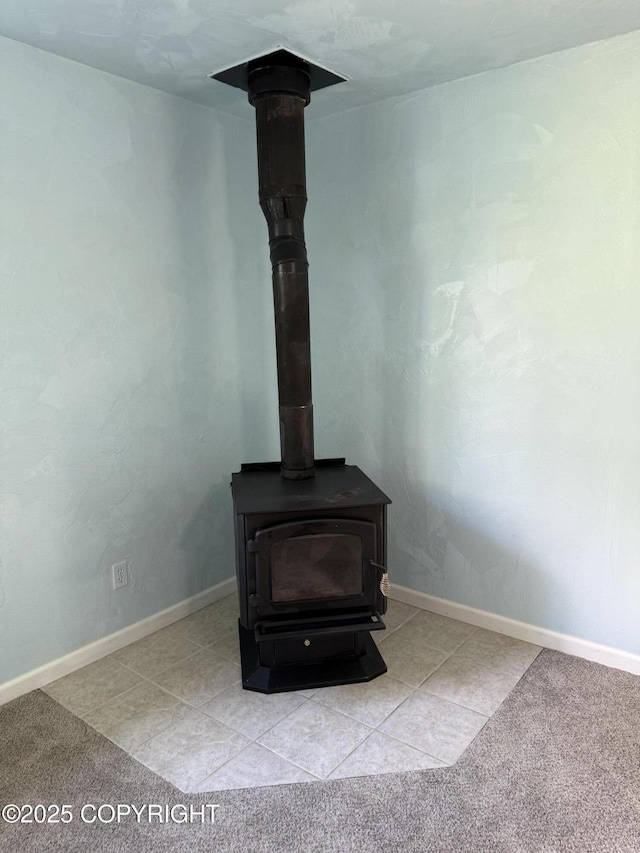 4100 W Peterson Bay Ct, Wasilla, AK 99623 - detailed view of a wood stove and carpet flooring