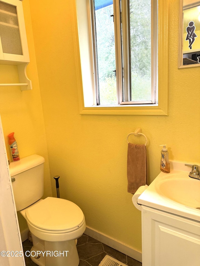 4100 W Peterson Bay Ct, Wasilla, AK 99623 - half bath featuring vanity, tile patterned floors, and healthy amount of natural light