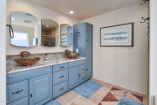 1240 Chinook Dr, Kenai, AK 99611 - full bathroom with double vanity and curtained shower