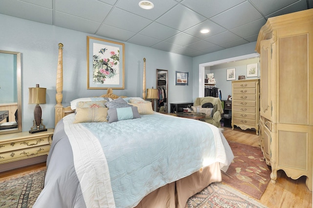 1240 Chinook Dr, Kenai, AK 99611 - bedroom with wood finished floors, a paneled ceiling, recessed lighting, a closet, and a spacious closet