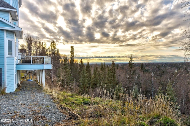 1240 Chinook Dr, Kenai, AK 99611 - yard at dusk featuring a forest view