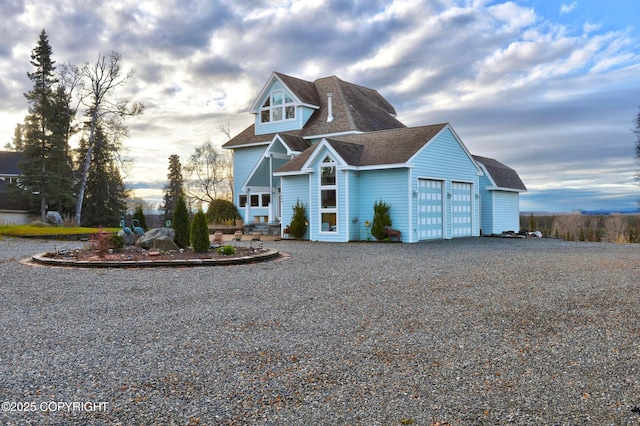 1240 Chinook Dr, Kenai, AK 99611 - view of front of house featuring gravel driveway, an attached garage, and roof with shingles