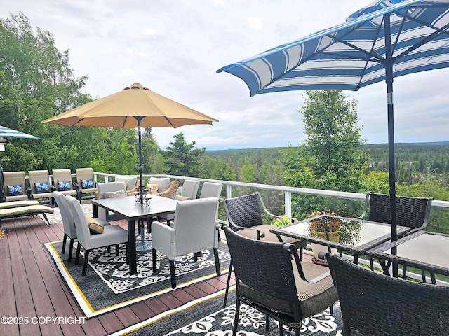 1240 Chinook Dr, Kenai, AK 99611 - wooden terrace with outdoor dining area and a wooded view