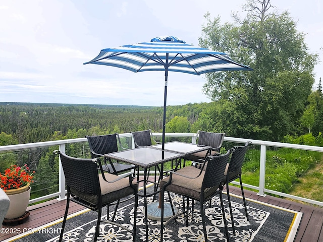 1240 Chinook Dr, Kenai, AK 99611 - wooden terrace featuring a wooded view and outdoor dining space