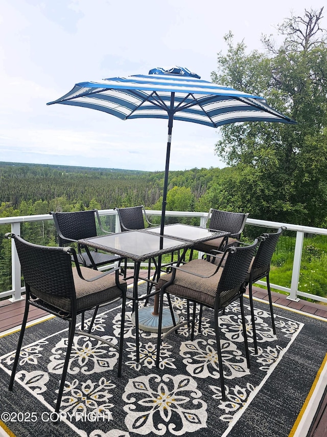 1240 Chinook Dr, Kenai, AK 99611 - wooden deck featuring a forest view and outdoor dining area
