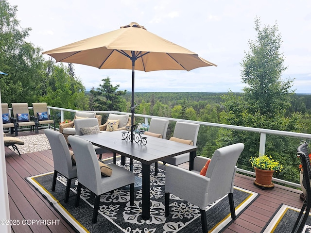 1240 Chinook Dr, Kenai, AK 99611 - wooden terrace with a wooded view and outdoor dining space