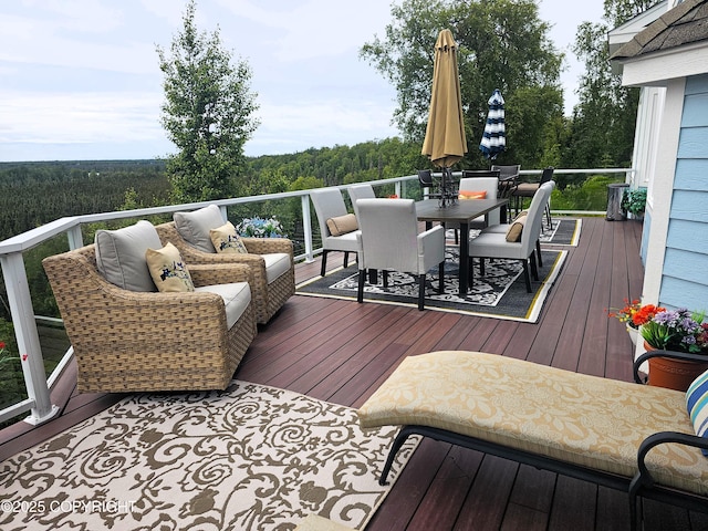 1240 Chinook Dr, Kenai, AK 99611 - wooden terrace featuring a wooded view and outdoor dining area
