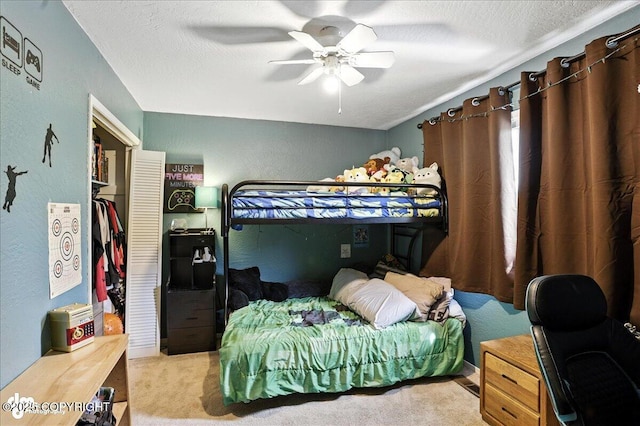 6260 Newt Dr, Anchorage, AK 99507 - carpeted bedroom with a textured wall, ceiling fan, and a textured ceiling
