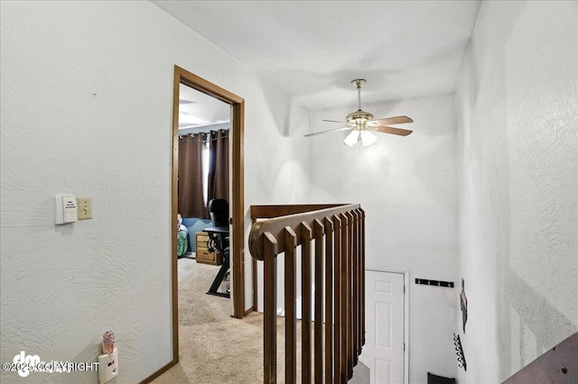 6260 Newt Dr, Anchorage, AK 99507 - hallway featuring light carpet and a textured wall