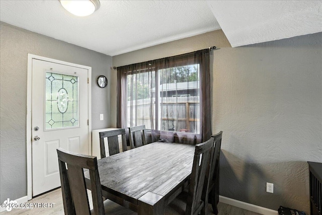 6260 Newt Dr, Anchorage, AK 99507 - dining space with light wood-type flooring and a textured wall