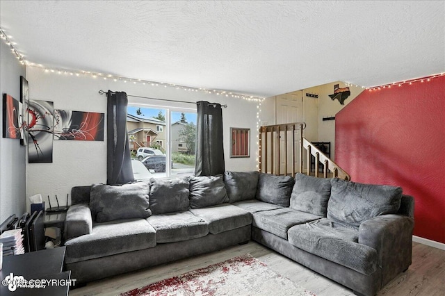 6260 Newt Dr, Anchorage, AK 99507 - living room featuring wood finished floors and a textured ceiling
