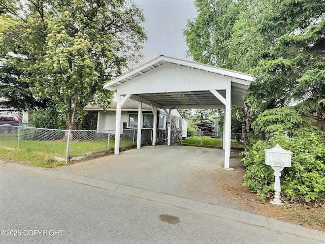 3505 N Star St, Anchorage, AK 99503 - view of vehicle parking featuring a detached carport and driveway