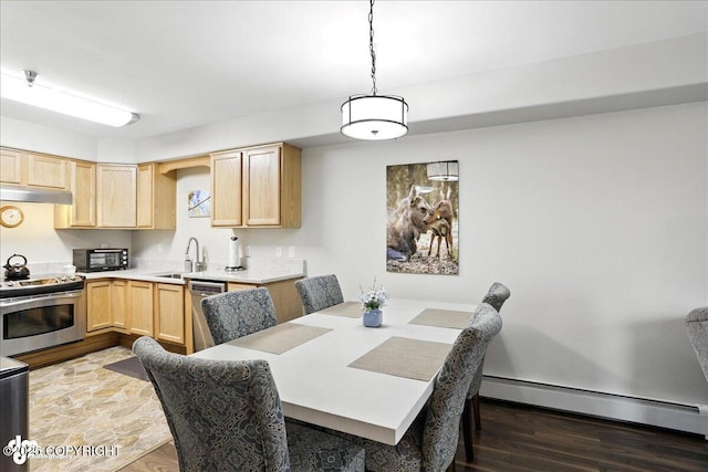 11351 Discovery View Dr # 106, Anchorage, AK 99515 - dining room featuring baseboard heating and wood finished floors