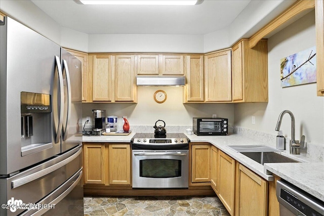 11351 Discovery View Dr # 106, Anchorage, AK 99515 - kitchen featuring appliances with stainless steel finishes, under cabinet range hood, light countertops, and light brown cabinetry