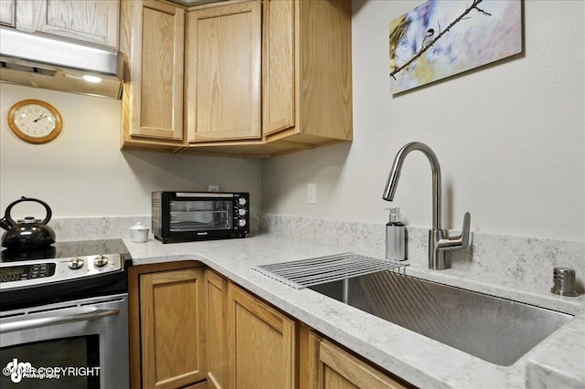 11351 Discovery View Dr # 106, Anchorage, AK 99515 - kitchen with stainless steel range with electric cooktop, under cabinet range hood, and light stone countertops