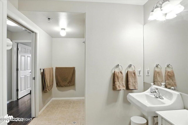 11351 Discovery View Dr # 106, Anchorage, AK 99515 - bathroom featuring a chandelier and tile patterned floors
