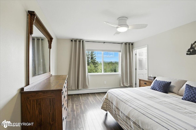 11351 Discovery View Dr # 106, Anchorage, AK 99515 - bedroom featuring a baseboard heating unit, wood finished floors, and a ceiling fan