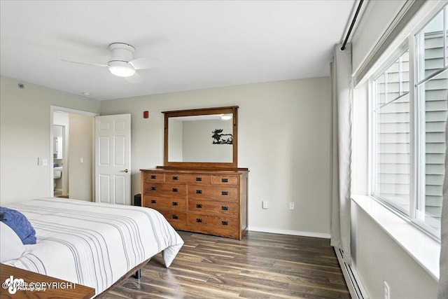 11351 Discovery View Dr # 106, Anchorage, AK 99515 - bedroom featuring baseboard heating, wood finished floors, and ceiling fan