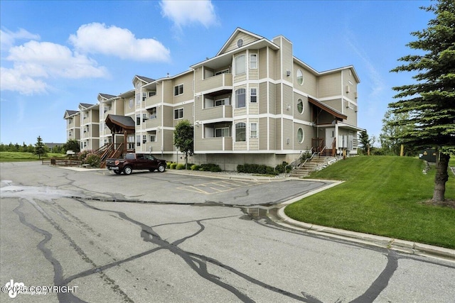 11351 Discovery View Dr # 106, Anchorage, AK 99515 - view of building exterior featuring uncovered parking