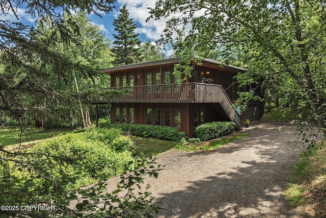 11851 Nebesna Dr, Anchorage, AK 99507 - view of front facade featuring asphalt driveway and a wooden deck