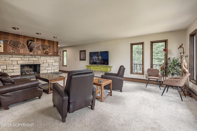 11851 Nebesna Dr, Anchorage, AK 99507 - living area featuring light colored carpet, a stone fireplace, and baseboard heating