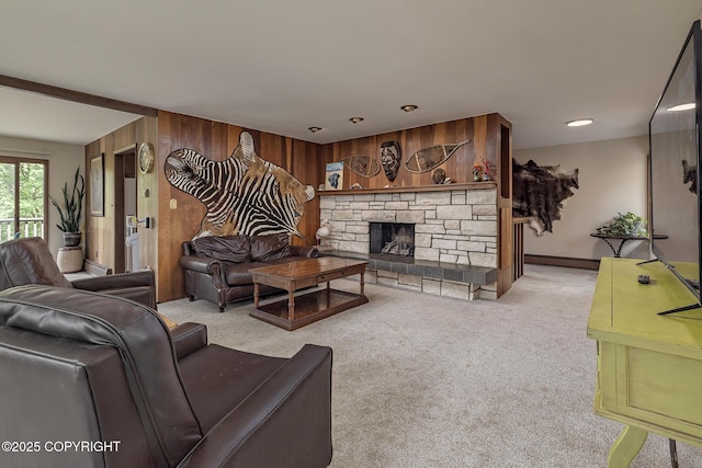 11851 Nebesna Dr, Anchorage, AK 99507 - carpeted living area with wooden walls, baseboard heating, and a stone fireplace