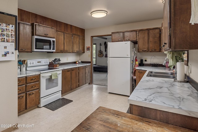 11851 Nebesna Dr, Anchorage, AK 99507 - kitchen featuring white appliances and light countertops