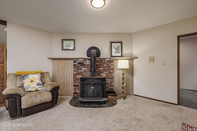 11851 Nebesna Dr, Anchorage, AK 99507 - carpeted living room with a wood stove and baseboards