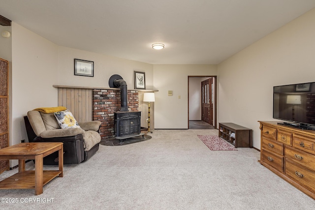 11851 Nebesna Dr, Anchorage, AK 99507 - living area featuring a wood stove and carpet