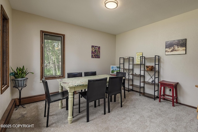 11851 Nebesna Dr, Anchorage, AK 99507 - dining area with a baseboard heating unit and light carpet