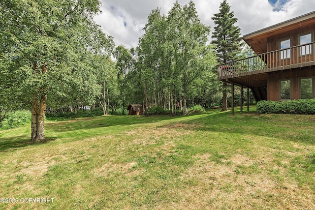 11851 Nebesna Dr, Anchorage, AK 99507 - view of green lawn featuring a deck