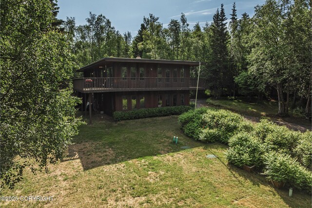11851 Nebesna Dr, Anchorage, AK 99507 - back of property featuring a yard, a deck, and a sunroom